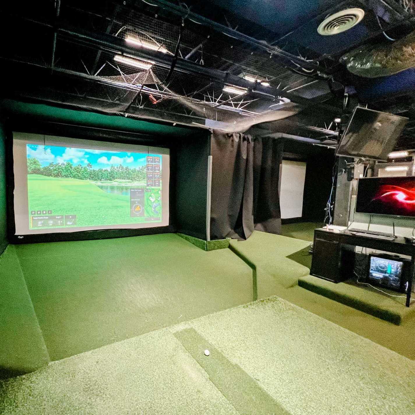 indoor golf driving simulator at newtown athletic club